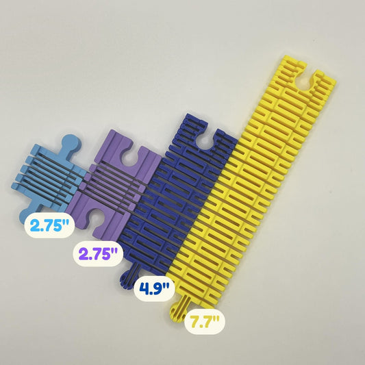 Flexi Wooden Train Tracks in four sizes side by side: two small at 2.75 inches, medium at 4.9 inches and large at 7.7 inches