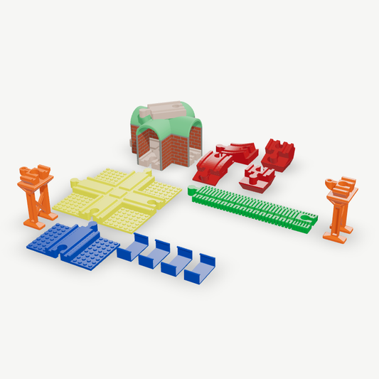 A wooden toy train accessory kit in the kit builder: painted bridge tunnel, incline set, brick crossing, flexible track, trestles, brick rail and track clips