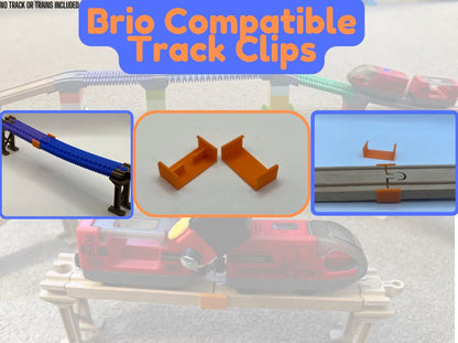 Track clips holding two pieces of wooden train track together
