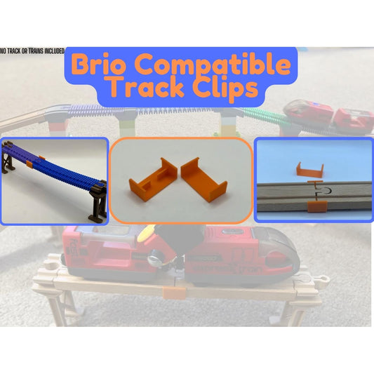 Orange track clips holding wooden train track pieces together on a raised layout